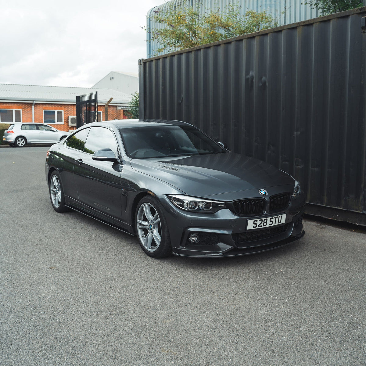 BMW F32 4 Series Coupe full carbon fiber kit by CT Carbon with twin exhaust, featuring splitter and MP style components.