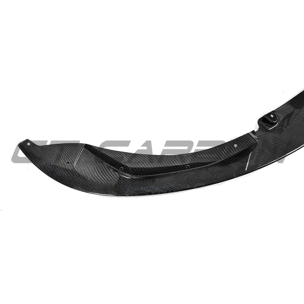 BMW M3 M4 F80 F82 F83 carbon fibre splitter by CT Carbon, showcasing a 3D-style front splitter design on a sleek vehicle.