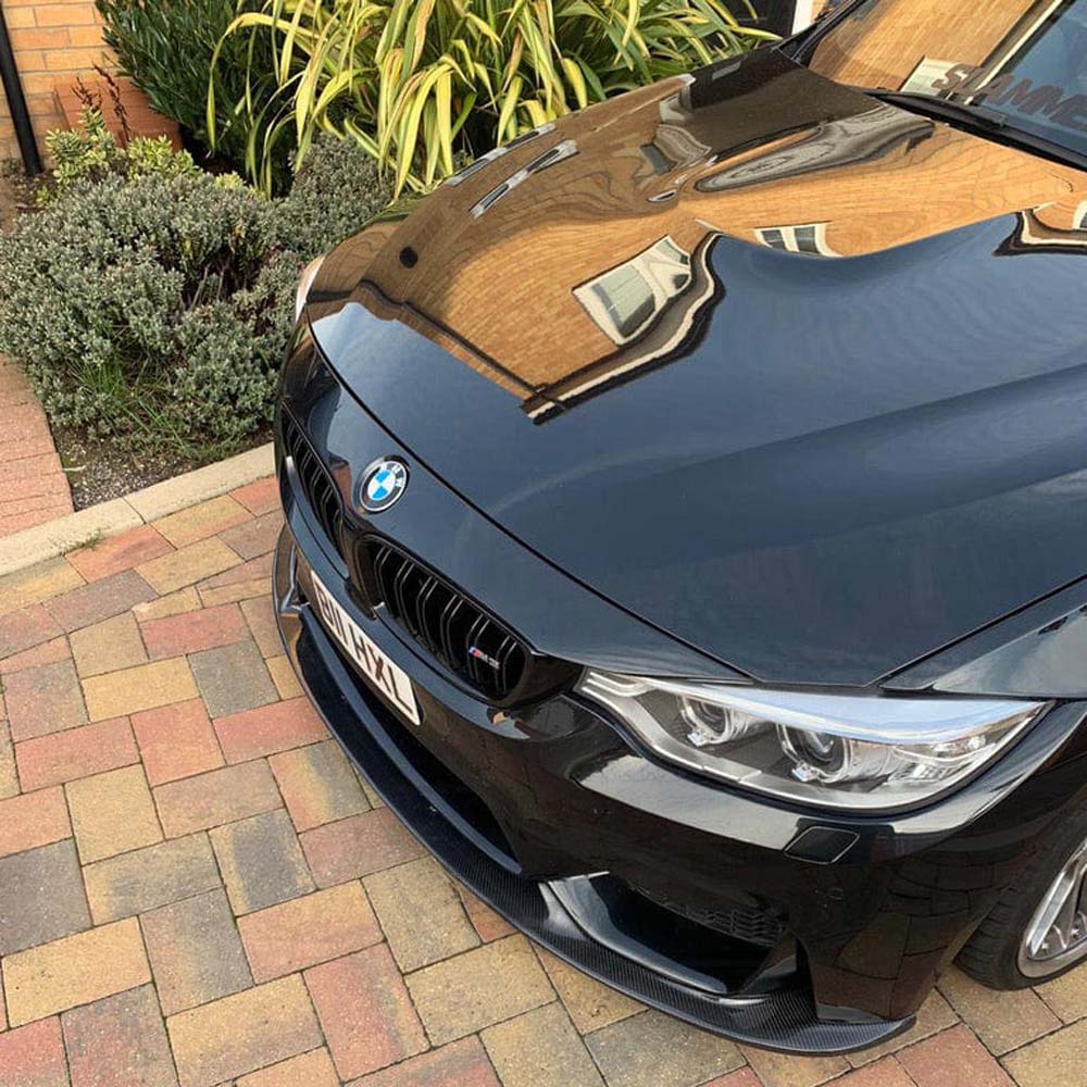 BMW M3 M4 F80 F82 F83 carbon fiber splitter by CT Carbon, showcasing a 3D-style front splitter with detailed carbon fiber texture.