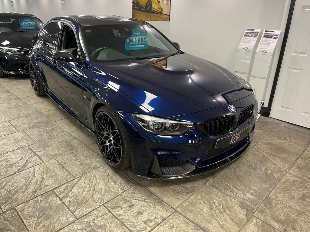 Full BMW M4 F83 convertible with CT Carbon full carbon fibre kit, including splitters and aerodynamic parts, showcasing a sleek carbon finish.