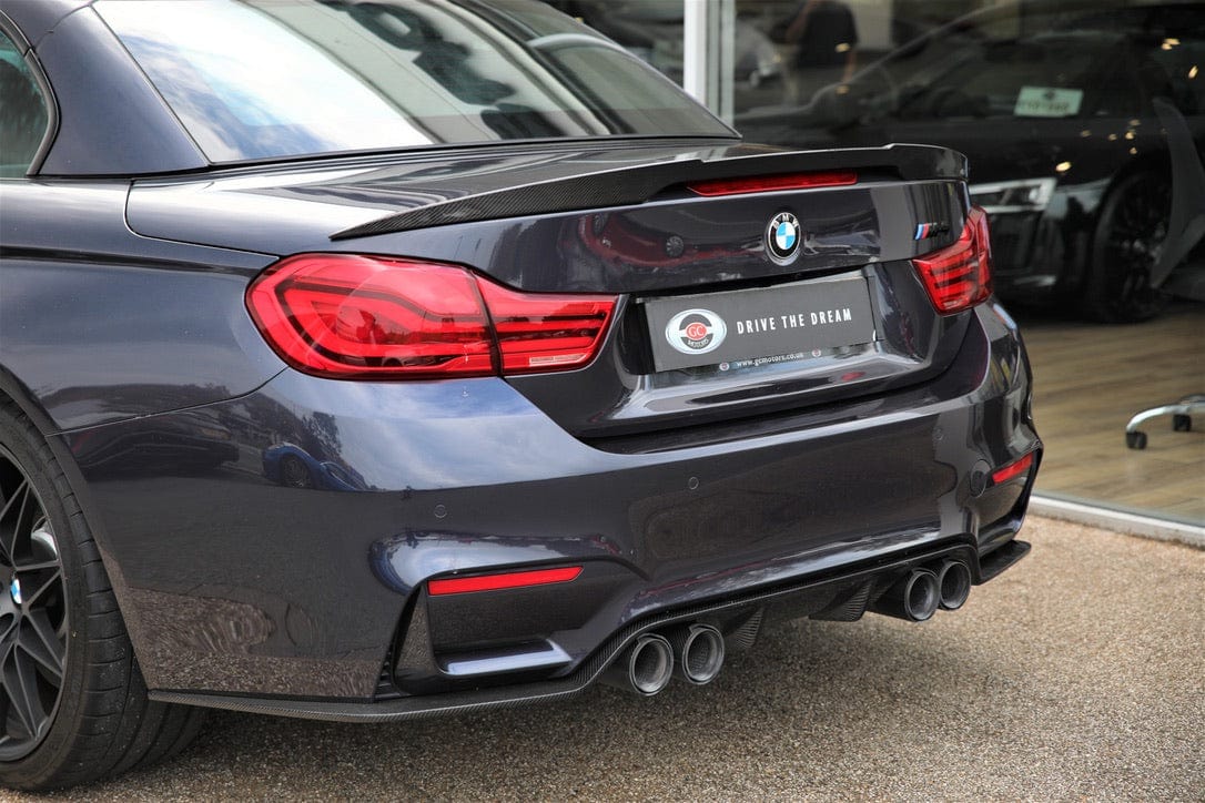 BMW M4 F83 convertible with CT Carbon full carbon fiber kit including splitter, showcasing sleek carbon fiber details.