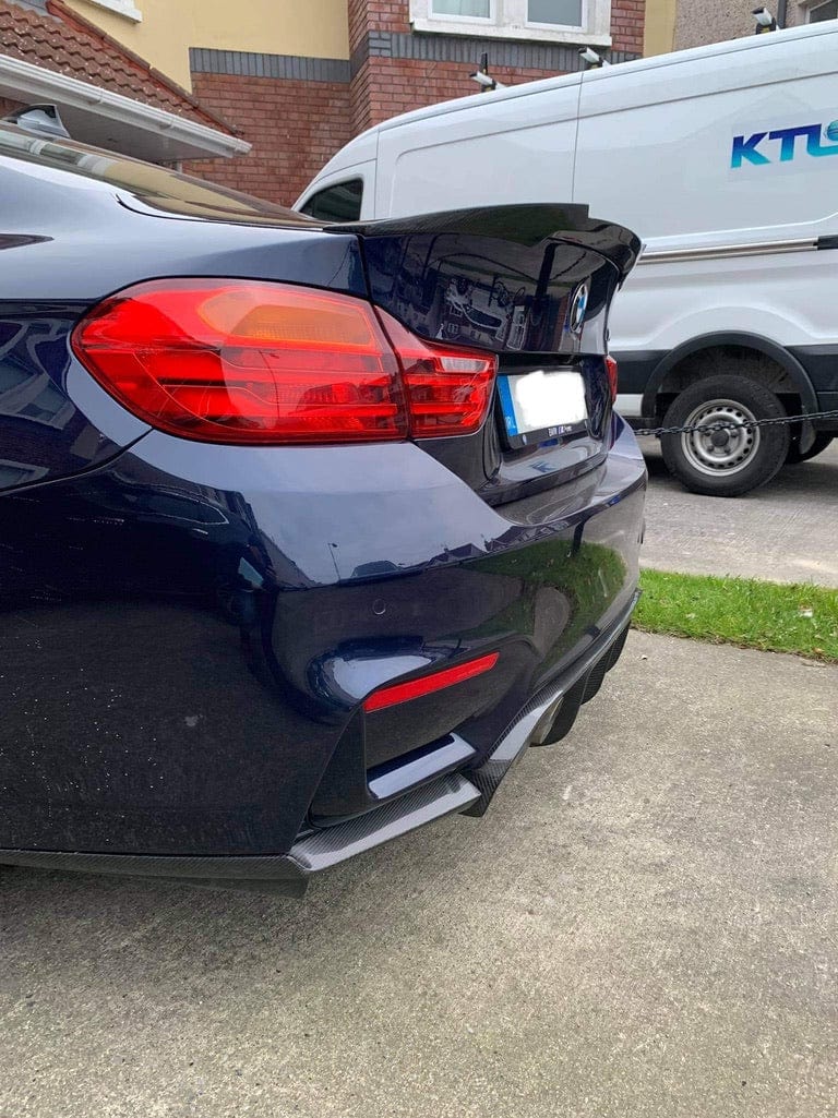 Full view of BMW M4 F83 convertible with CT Carbon full carbon fiber kit, showcasing the carbon splitter and aerodynamic enhancements.
