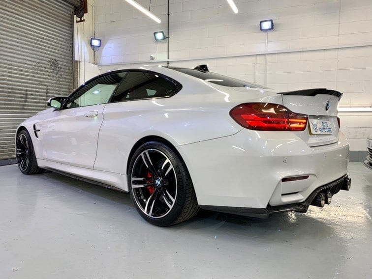 BMW M4 F83 convertible with CT Carbon full carbon fibre kit, showing splitter and aerodynamic enhancements on the car's exterior.