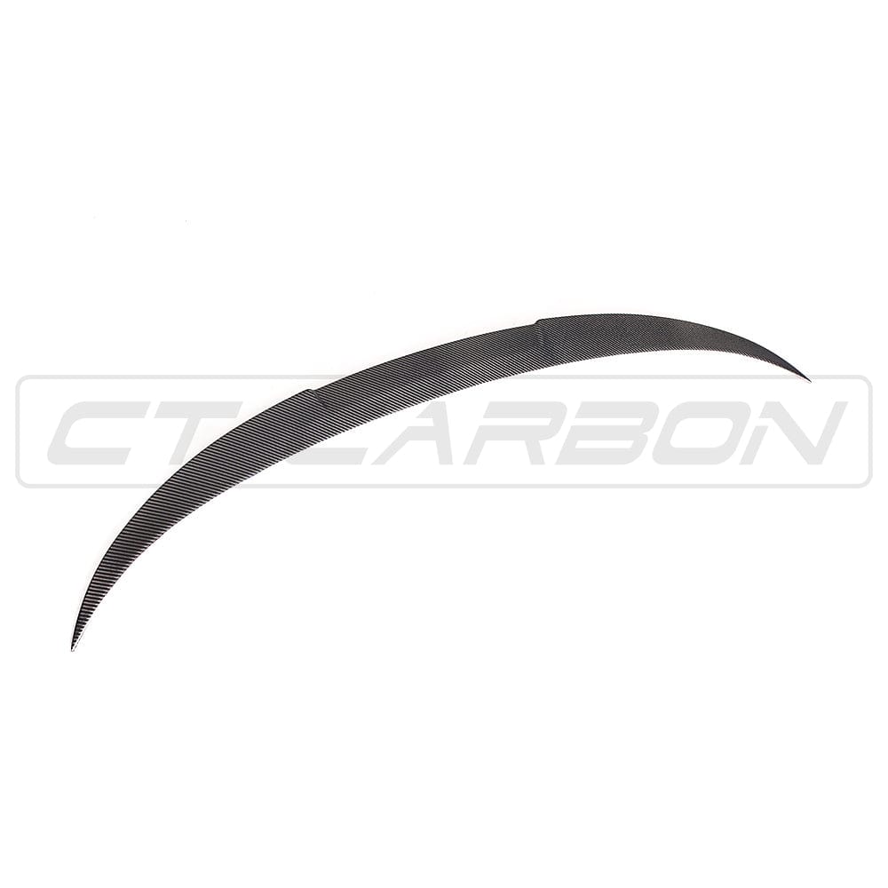 BMW M4 F83 convertible with CT Carbon full carbon fiber kit, including splitter and aerodynamic enhancements, showcasing sleek carbon fiber details.