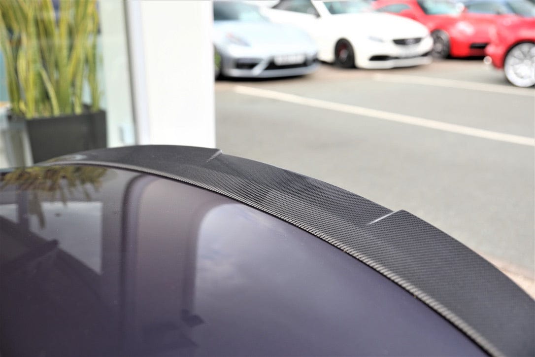 BMW M4 F83 convertible with CT Carbon full carbon fibre kit, showing splitters and aerodynamic enhancements on the car's exterior.