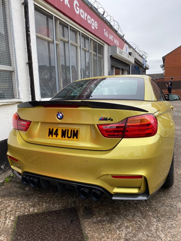 Full view of a BMW M4 F83 convertible with CT Carbon full carbon fibre kit, showcasing the carbon splitter and body enhancements.