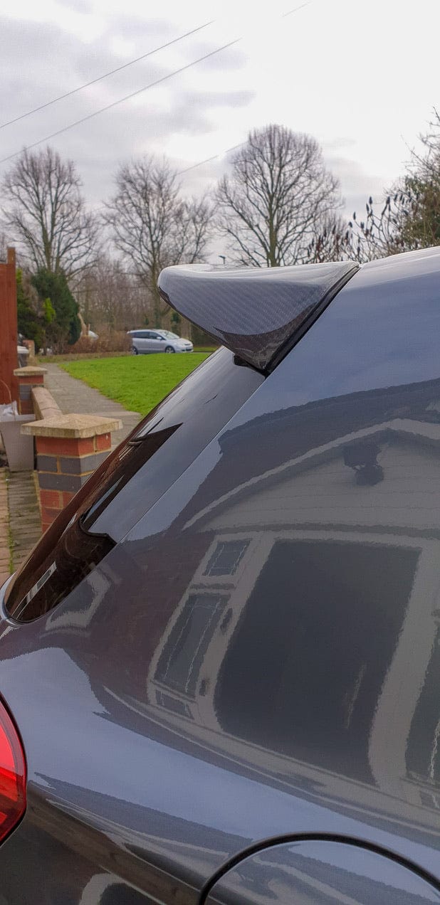 BMW 1 Series F20 M-Sport carbon spoiler by CT Carbon, showing a 3D-style aerodynamic car spoiler with sleek carbon fiber finish.