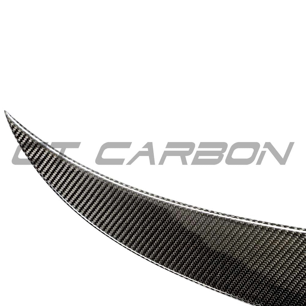 BMW G83 M4 full carbon fibre kit by CT Carbon, featuring a sleek carbon fibre spoiler on a BMW M4 G83 model.