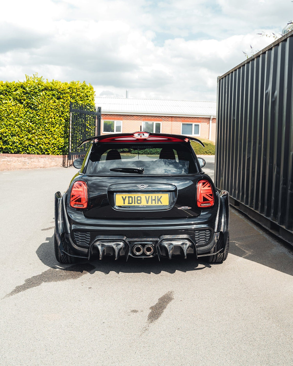 Carbon fibre spoiler for MINI Cooper S F56 JCW Sport Pack by CT Carbon, showing sleek aerodynamic design on the car's rear.