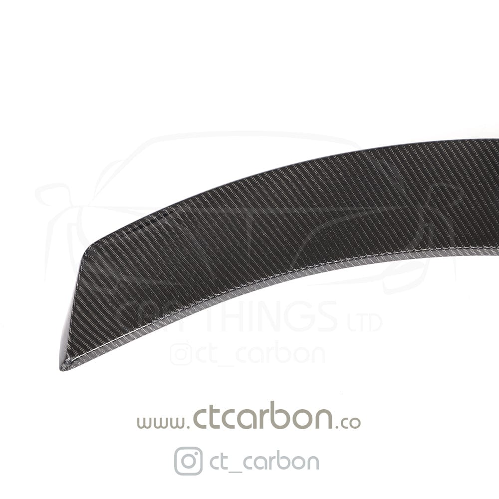 Carbon fibre spoiler for Toyota Supra 2019+ A90 by CT Carbon, shown mounted on the car's rear for aerodynamic enhancement.