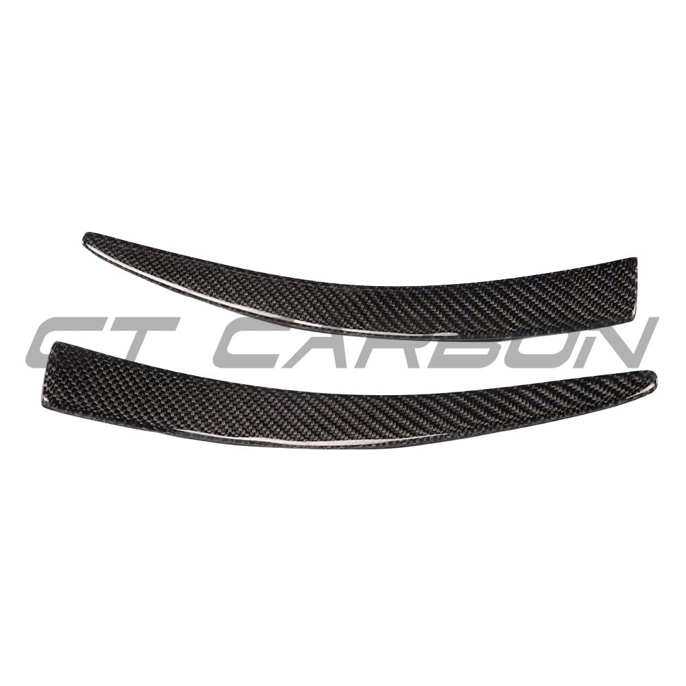 BMW M3 M4 F80 F82 F83 carbon fibre canard fins by CT Carbon, close-up of aerodynamic accessories on vehicle front.