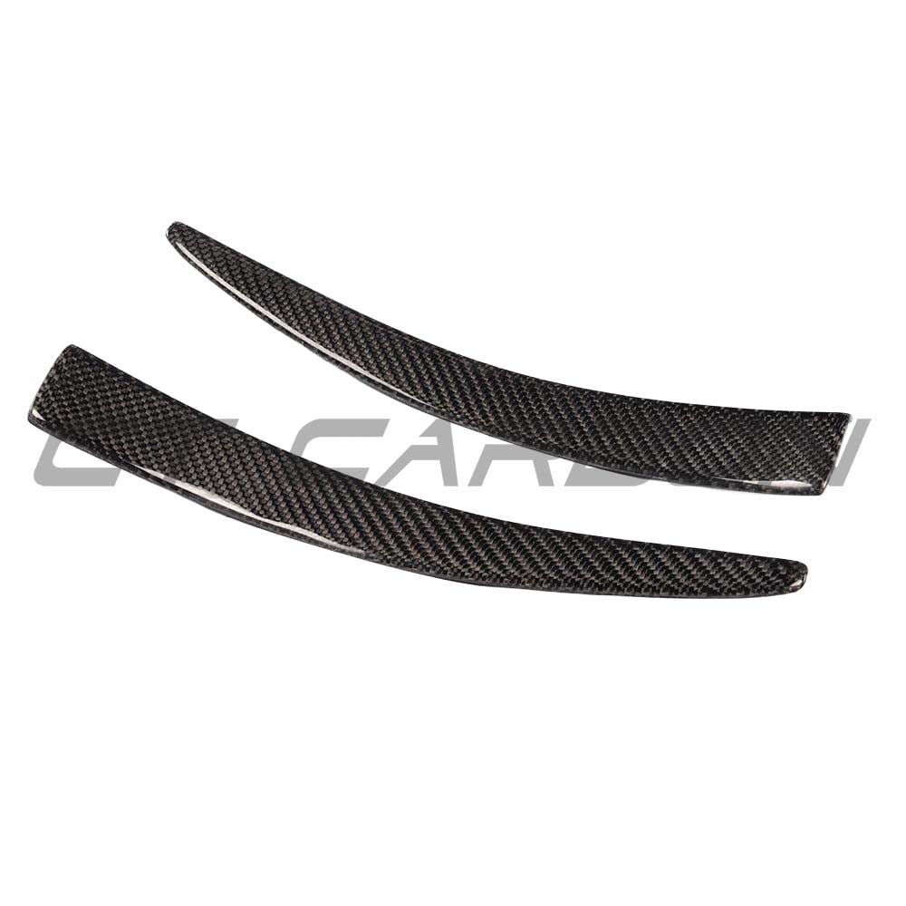 BMW M3 M4 F80 F82 F83 carbon fiber canard fins by CT Carbon, close-up of aerodynamic front canard fins on vehicle.