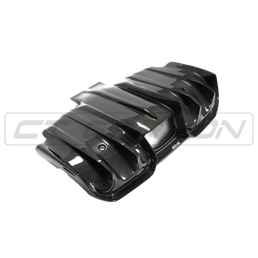 Mini F56 Cooper S JCW carbon fiber diffuser by CT Carbon, showcasing sleek, textured carbon fiber surface and aerodynamic design.
