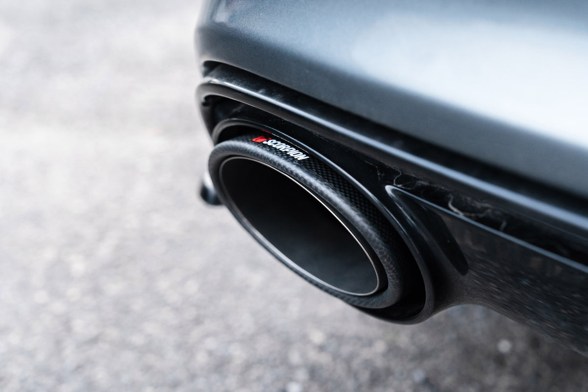 Pair of Scorpion Audi RS7 C7 tailpipe trim in carbon fibre with Ascari RS design, designed for a sleek, sporty look.