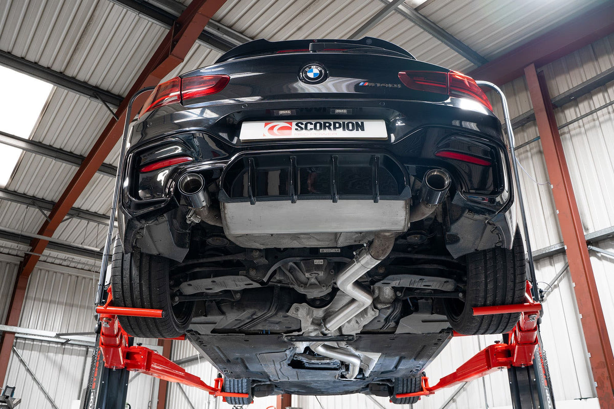 Scorpion BMW M140i and M240i OEM resonator delete pipe installed on F20, F21, and F22 models, with xDrive compatibility.
