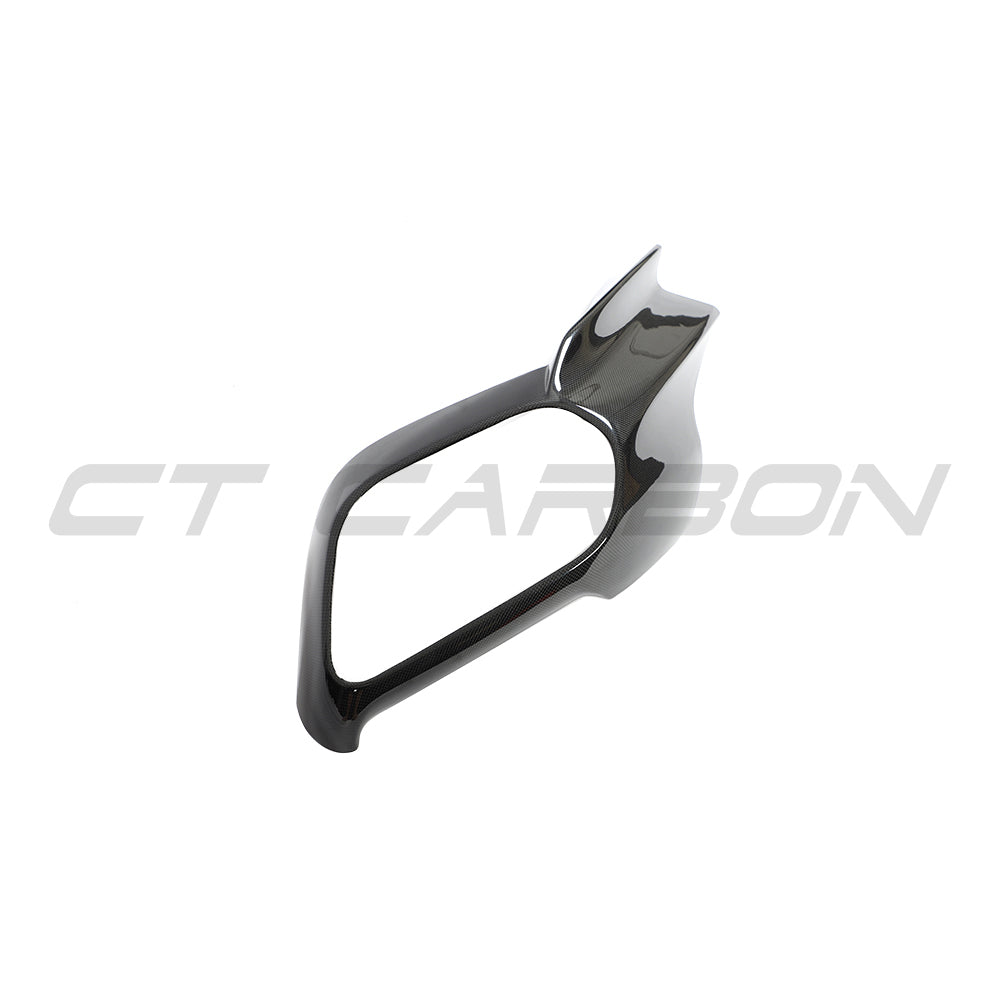 Ferrari 812 Superfast & GTS carbon fiber exhaust trim cover by CT Carbon, close-up of sleek, textured carbon fiber accessory.