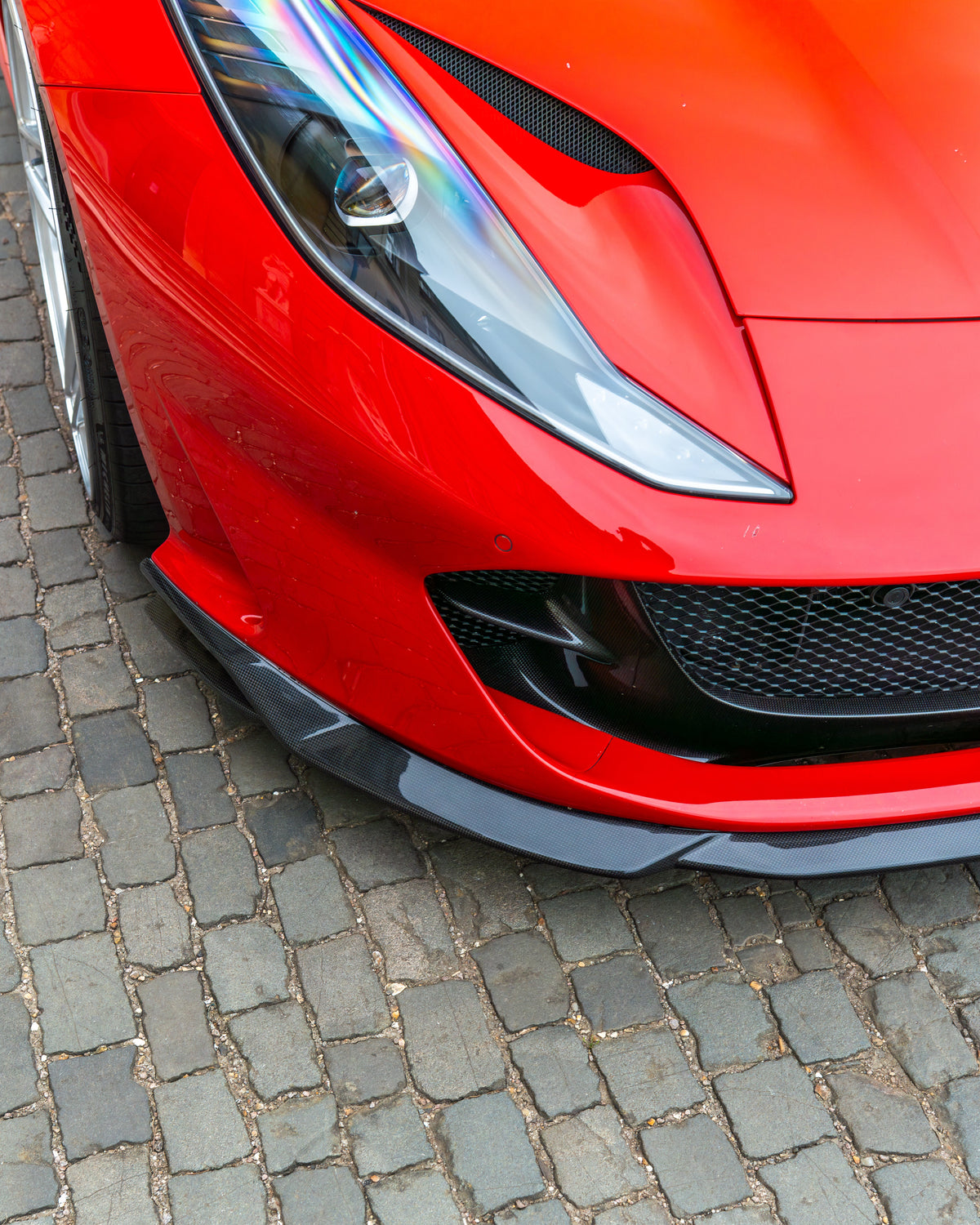 Ferrari 812 Superfast carbon fibre kit by CT Design, featuring a splitte with detailed carbon fibre finish.