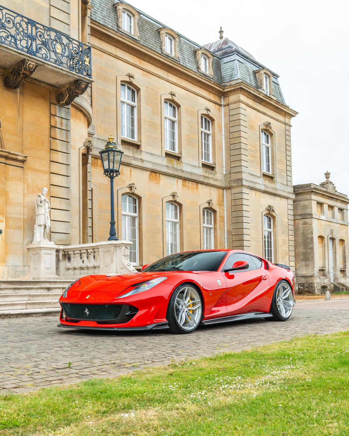 Ferrari 812 Superfast carbon fibre side skirts extension kit by CT Carbon, showing sleek black textured carbon fibre details.
