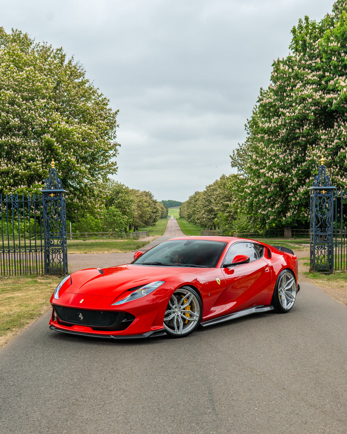 Side view of Ferrari 812 Superfast with CT Carbon's V1 carbon fibre side skirts extension kit installed.