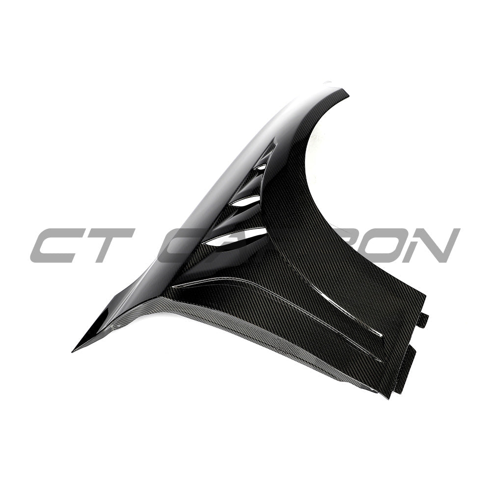 BMW F87 M2 carbon fiber fenders by CT Carbon, showcasing sleek, lightweight design with a smooth finish on a sports car.