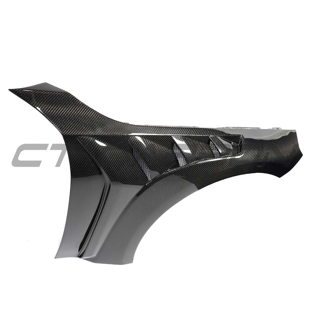 BMW G87 M2 full carbon fiber CT Design conversion kit displayed on a car, showcasing lightweight carbon fiber components and sleek design.