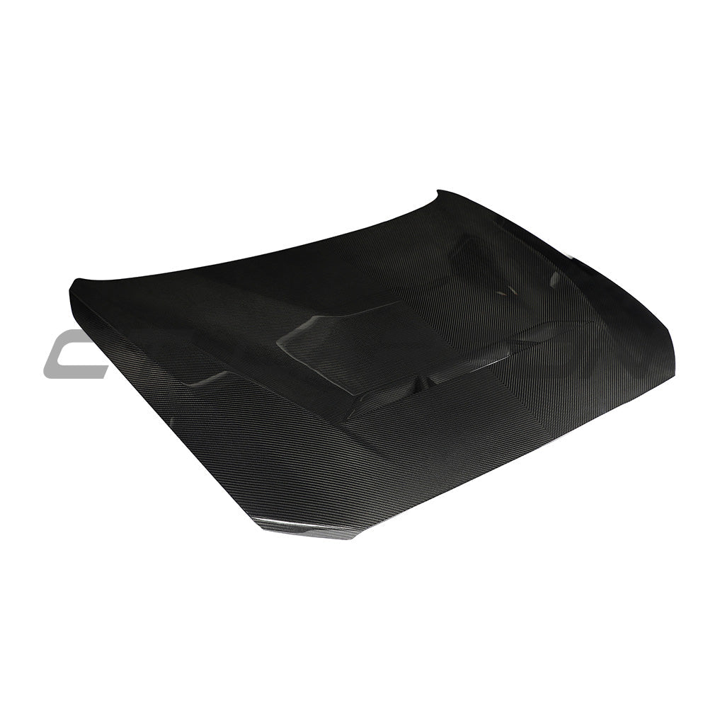 BMW F87 M2, M2C, F20, F22 carbon fiber bonnet by CT Design, showing lightweight, aerodynamic car hood with textured carbon fiber surface.