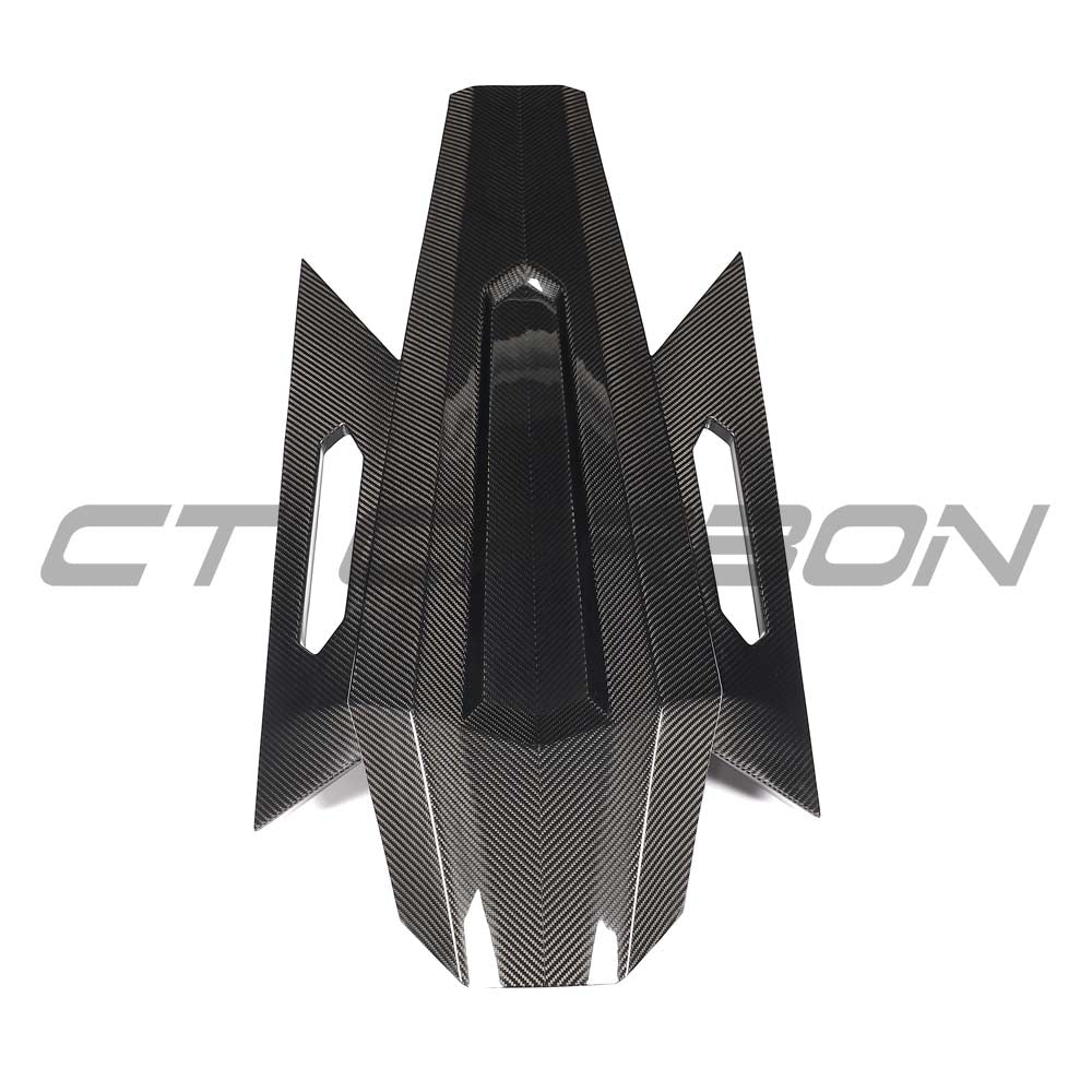 Lamborghini Revueltto carbon fibre engine cover and roof scoop by CT Carbon, showing sleek aerodynamic design and textured surface.