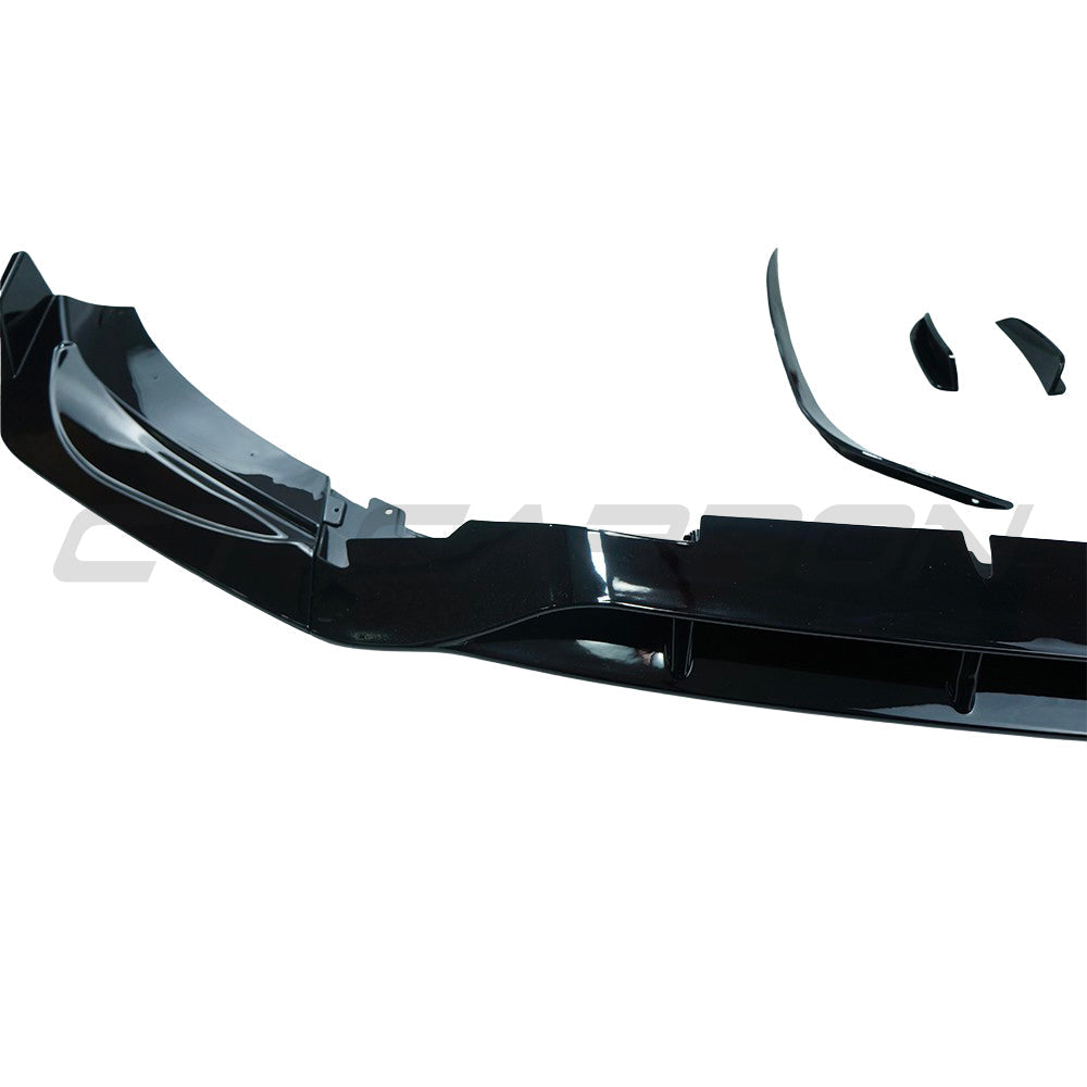Mercedes W206 2021+ C-Class CT Carbon gloss black front end trim splitter showing sleek, aerodynamic design on a sporty vehicle.
