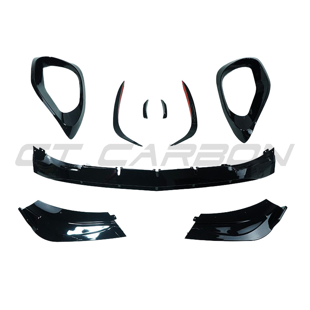 Mercedes W206 2021+ C-Class CT Carbon gloss black front end trim splitter showing sleek, aerodynamic design on a vehicle.
