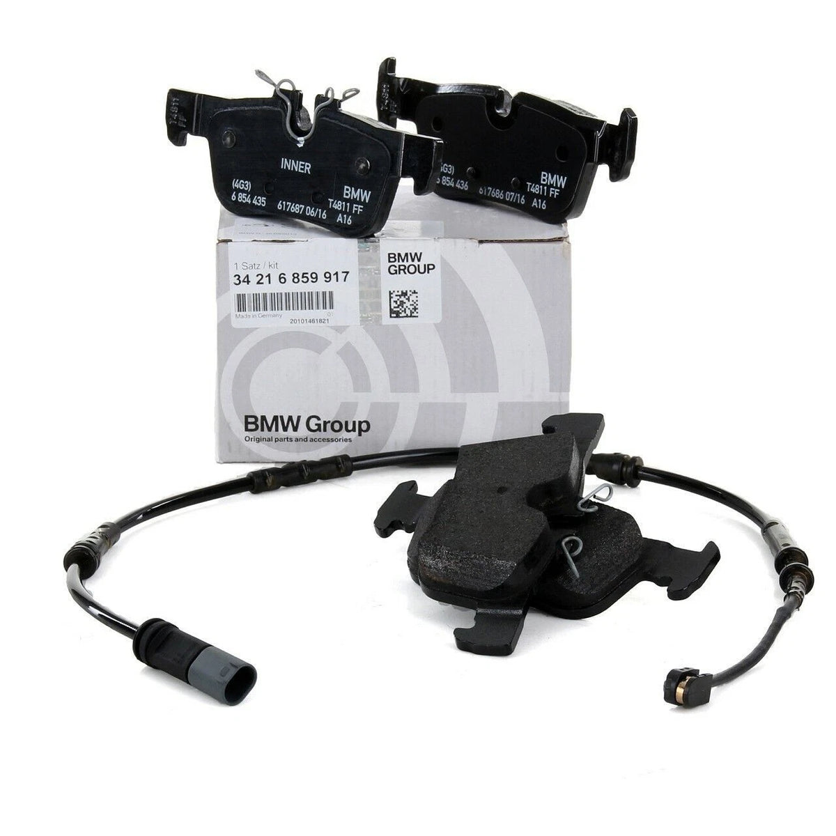 Genuine BMW F45 2 Series Active Tourer rear brake pads with sensor, showing metal backing plates and friction material for safe braking.